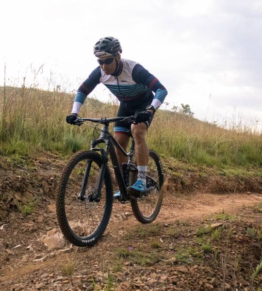 mtb rider, cycling up open trail