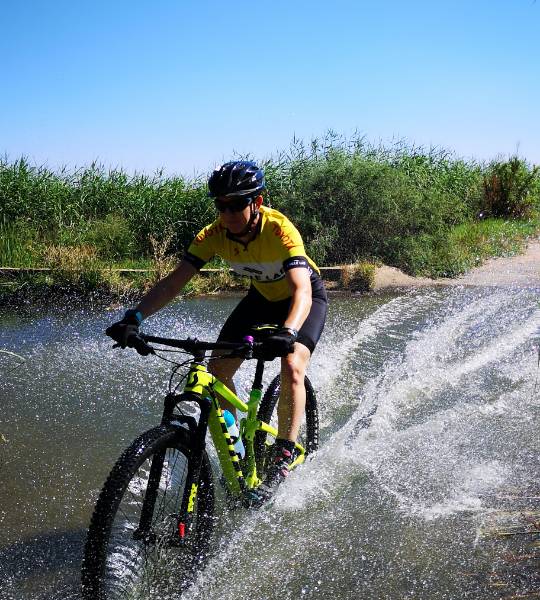 mtb rider, riding through water